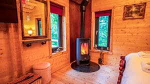 A romantic lodge with hot tub for 2, with roaring fire at the end of the bed and a TV for cosy, romantic nights in. A cosy couples, hot tub retreat.