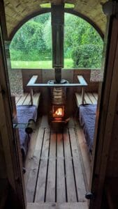 The complimentary wood burning sauna with a view to the duck pond and woodland is ready for a private 1 hour session for 2 during a romantic hot tub getaway yorkshire