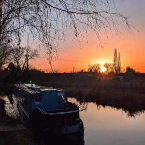 Sunset views from the canal boat and hot tub make this waterside, woodland retreat a magical winter holiday on the Chesterfield Canal.