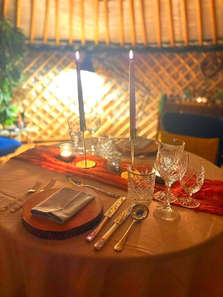 A table for 2 set for a romantic private chef dinner with specially curated wine pairing. The perfect setting for romantic private dining Yorkshire.